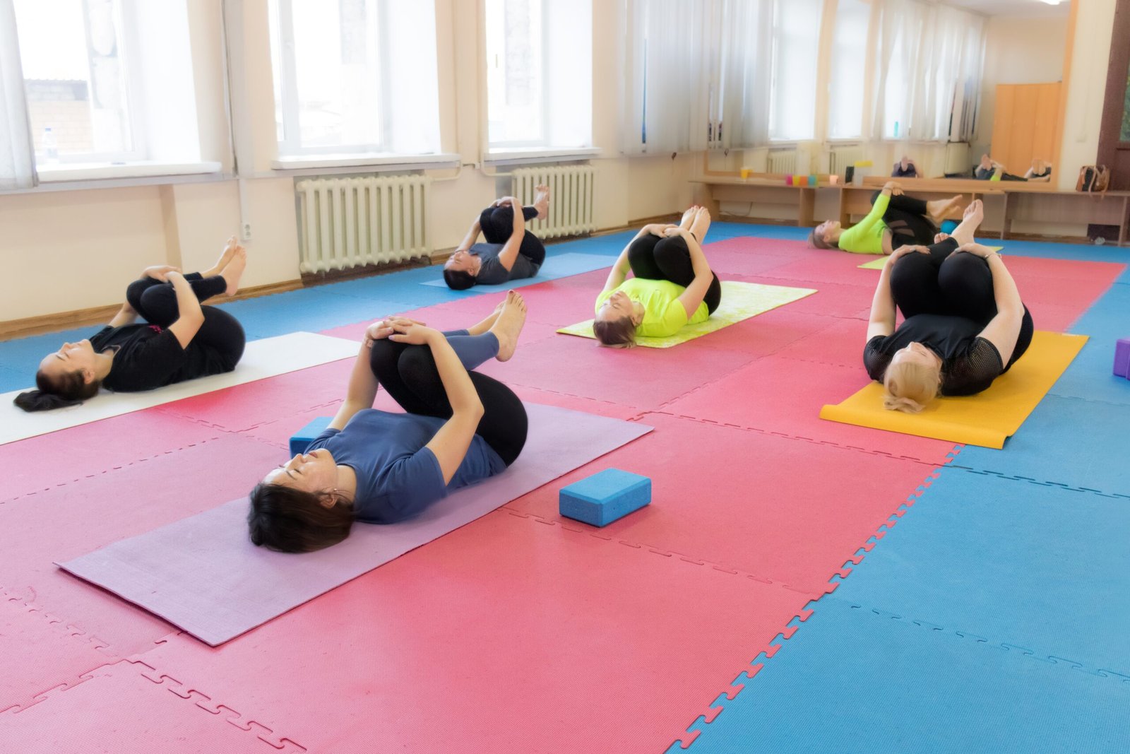 health-and-wellness-group-yoga-lesson-young-wome-2025-01-10-07-01-22-utc