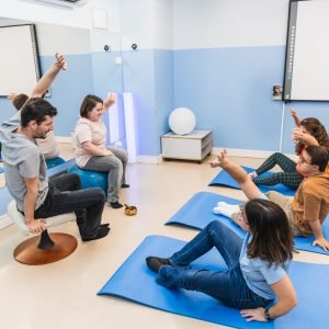 A lively yoga class with participants including those with Down syndrome.